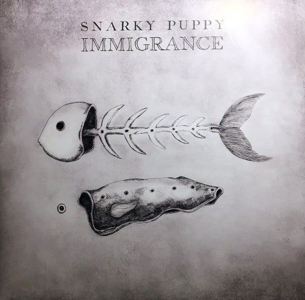 Snarky Puppy – Immigrance, pochette